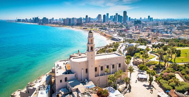 Illustrative skyline of Tel Aviv with an airplane overhead